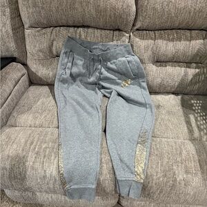 Nike Women's Gray Joggers with Gold Accents